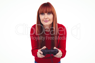 Smiling hipster woman playing video games