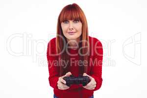 Smiling hipster woman playing video games