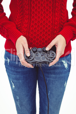 Mid section of a hipster woman playing video games