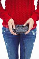 Mid section of a hipster woman playing video games