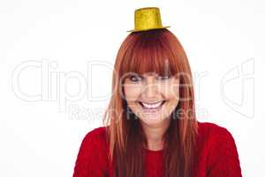 Smiling hipster woman with party hat