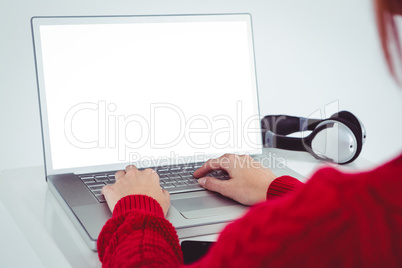 Hipster woman using laptop with a white screen