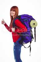 Smiling hipster woman with a travel bag