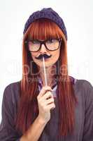 Smiling hipster woman with mustache