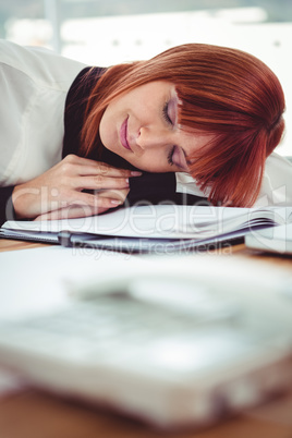 Hipster businesswoman falling in sleep at her desk