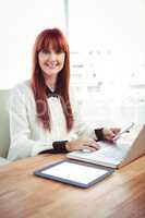 Mid section of a hipster businesswoman using her devices