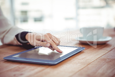 Hipster businesswoman using her tablet