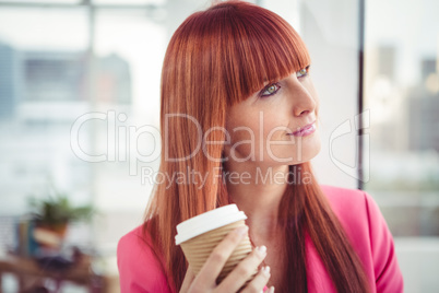 Portrait of a hipster businesswoman drinking a coffee cup