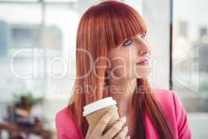 Portrait of a hipster businesswoman drinking a coffee cup
