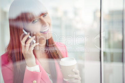 Hipster businesswoman having a phone call