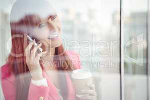 Hipster businesswoman having a phone call