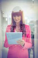 Hipster businesswoman using her tablet