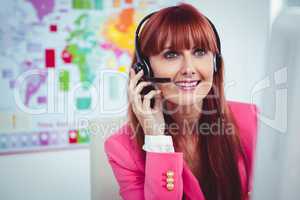 Smiling hipster businesswoman using headset