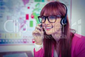 Smiling hipster businesswoman with headset