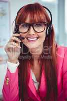 Smiling hipster businesswoman with headset