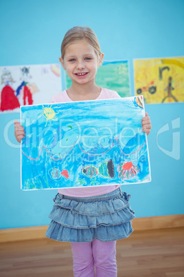 Cute girl showing her drawing
