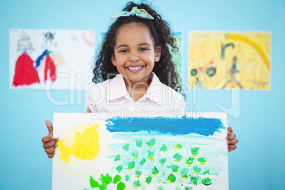 Cute girl showing her drawing