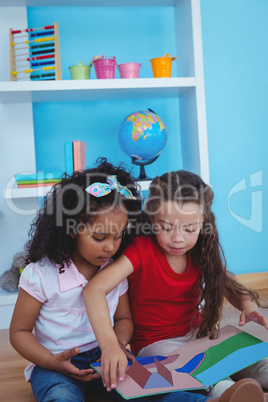 Cute girls holding a book