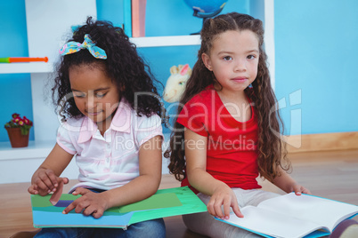 Cute girls holding books