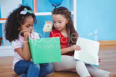 Cute girls holding books