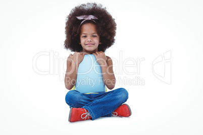 Cute girl sitting on the floor holding tablet