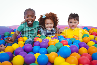 Cute smiling kids in sponge ball pool