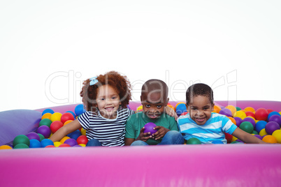 Cute smiling kids in sponge ball pool