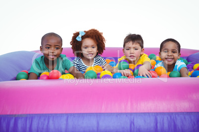 Cute smiling kids in sponge ball pool