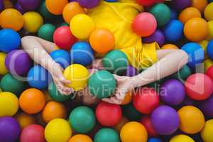 Cute smiling boy in sponge ball pool