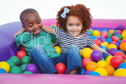 Cute smiling kids in sponge ball pool