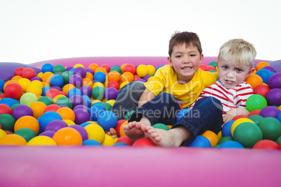 Cute smiling boys in sponge ball pool