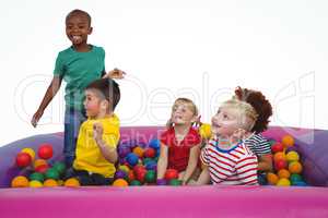 Cute smiling kids in sponge ball pool