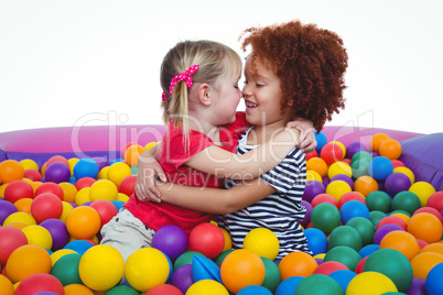 Cute smiling girls in sponge ball pool