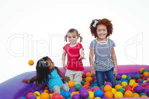 Cute smiling girls in sponge ball pool