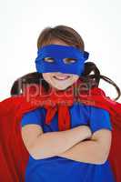 Masked girl with arms crossed pretending to be superhero