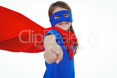 Smiling masked girl pretending to be superhero