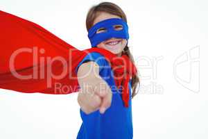 Smiling masked girl pretending to be superhero