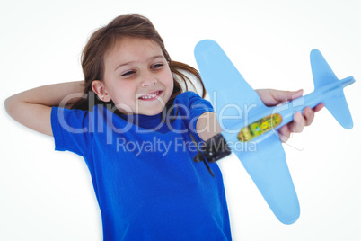 Cute girl playing with airplane