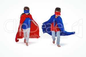 Masked kids running pretending to be superheroes