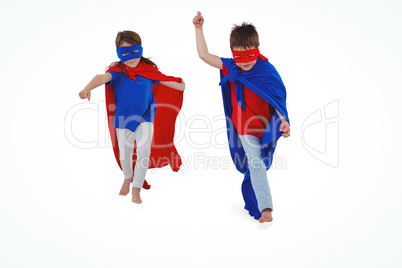 Masked kids walking pretending to be superheroes