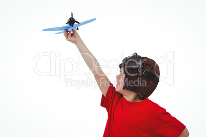 Boy playing with toy airplane