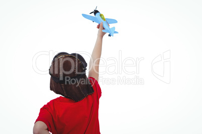 Boy playing with toy airplane