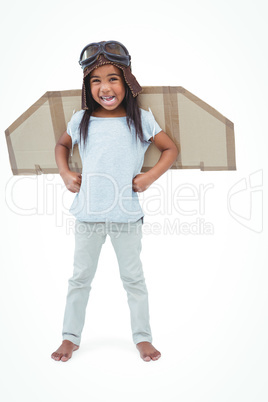 Standing girl with fake wings pretending to be pilot