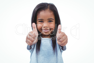 Smiling girl showing thumbs to camera