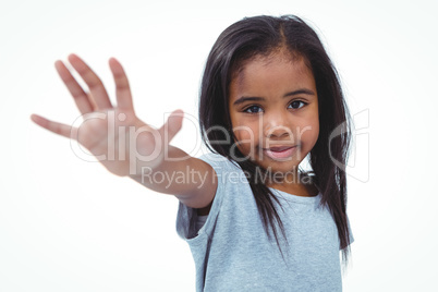 Smiling girl holding hand to the camera