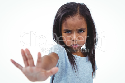 Girl making grimace holding hand to camera