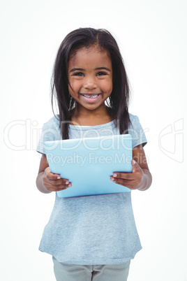 Standing girl using tablet and smiling at the camera