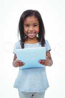 Standing girl using tablet and smiling at the camera