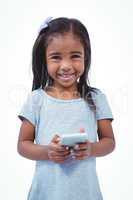 Standing girl using tablet and smiling at camera