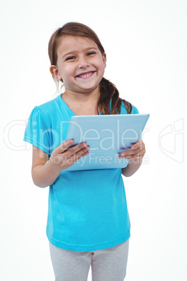 Standing girl using tablet and smiling at camera